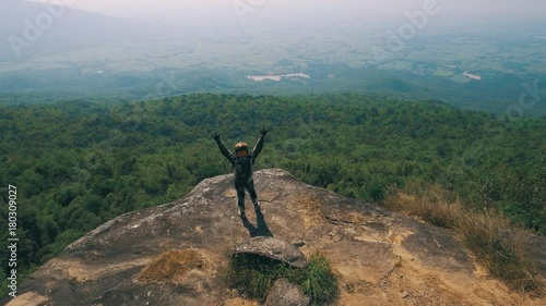 adventure biker at cliff viewpoint