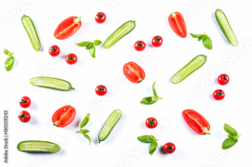 Fresh food pattern with cucumbers, peppers, tomatoes and herbs.