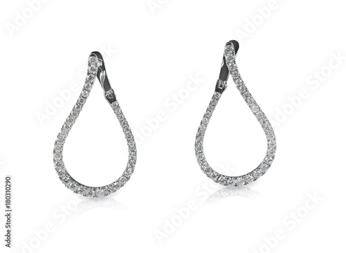 Diamond dangle drop earrings isolated on white