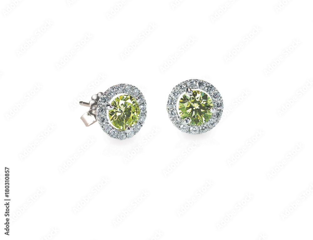 Green Peridot and diamond earrings isolated on white Green Peridot and diamond earrings isolated on white
