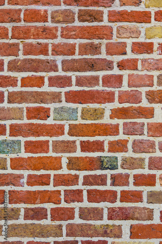 old brick wall with multi-colored bricks