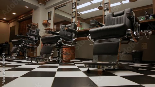 the camera on the Steadicam shows the interior of a Barber shop with a beautiful design.