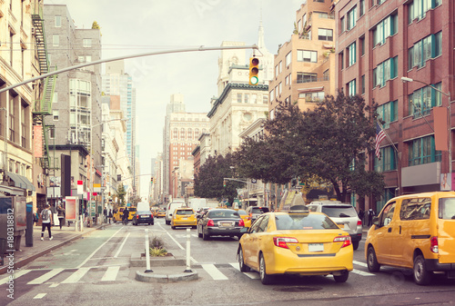 Citylife and traffic on Manhattan's avenue, New York City, United States. Toned image