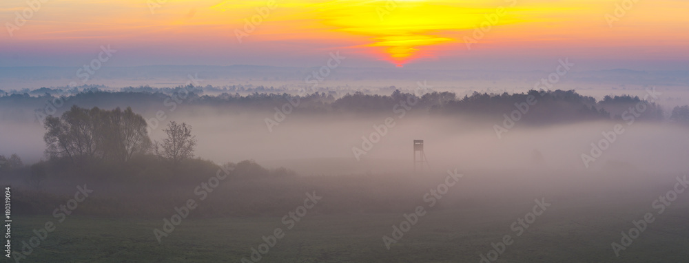 Fototapeta premium hunting tower in beautiful misty scenery