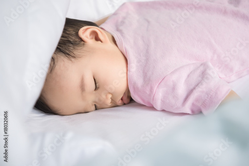 Asian baby sleeping on the bed,thailand people,relax time