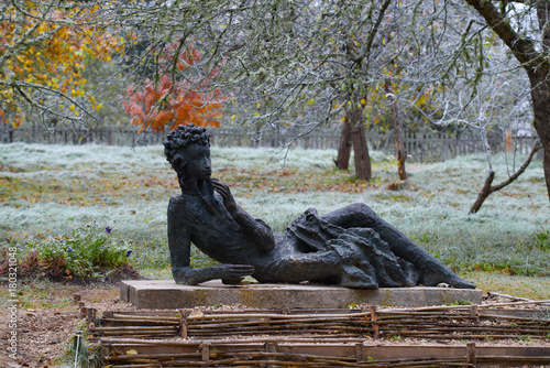 Sculpture of the Pushkin A. S. in an Apple orchard. Mikhailovskoe photo