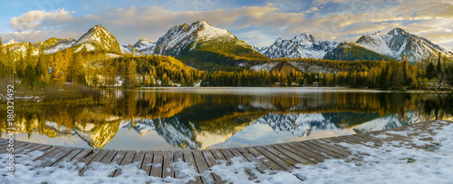 Canvas Print frosted bridge over the mountain lake Strbske Pleso in Slovakia, snowy mountains