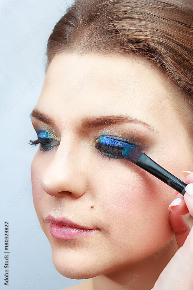 make-up artist doing eye make-up, close-up
