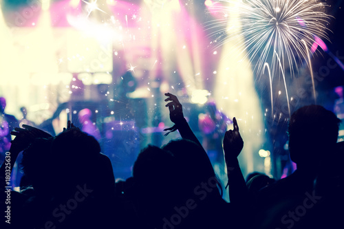 new Year concept - cheering crowd and fireworks