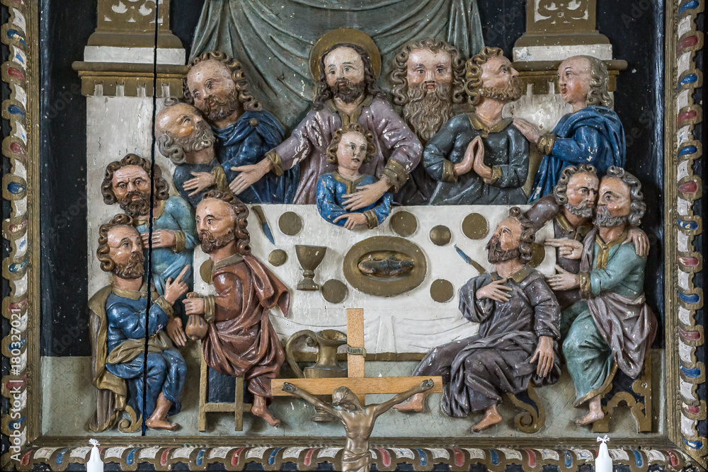 Jesus and the disciples at the last supper. Ancient altarpiece made by wood.