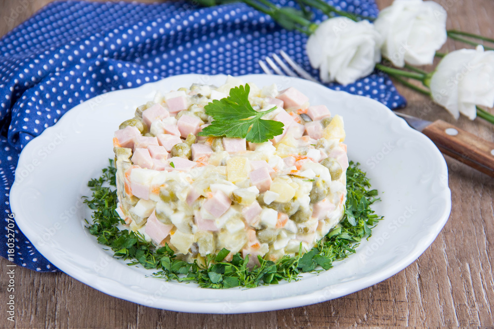 Classic Russian salad with sausage, peas, potatoes, carrots and mayonnaise, tasty traditional dish,snack. Classic Russian salad with sausage, peas, potatoes, carrots and mayonnaise, tasty traditional dish,snack.