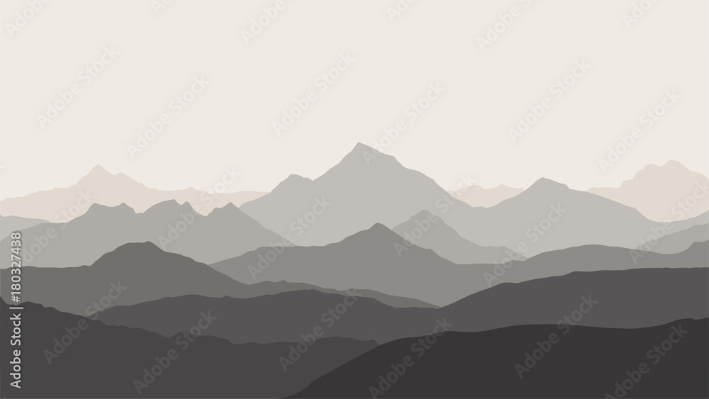 panoramic view of the mountain landscape with fog in the valley below with the alpenglow grey sky