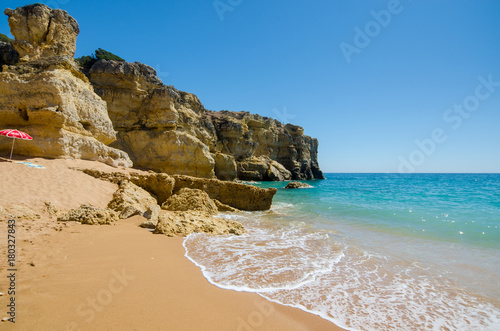 View of limestone cliffs of the Rabbit Beach in Albufeira, District Faro, Algarve, Southern Portugal