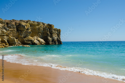 View of limestone cliffs of the Rabbit Beach in Albufeira, District Faro, Algarve, Southern Portugal