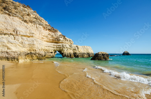 View of limestone cliffs of the Three Castles beach in Portimao, District Faro, Algarve, Southern Portugal 