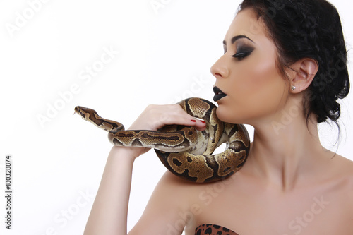 beautiful young girl with a Python in his hands
