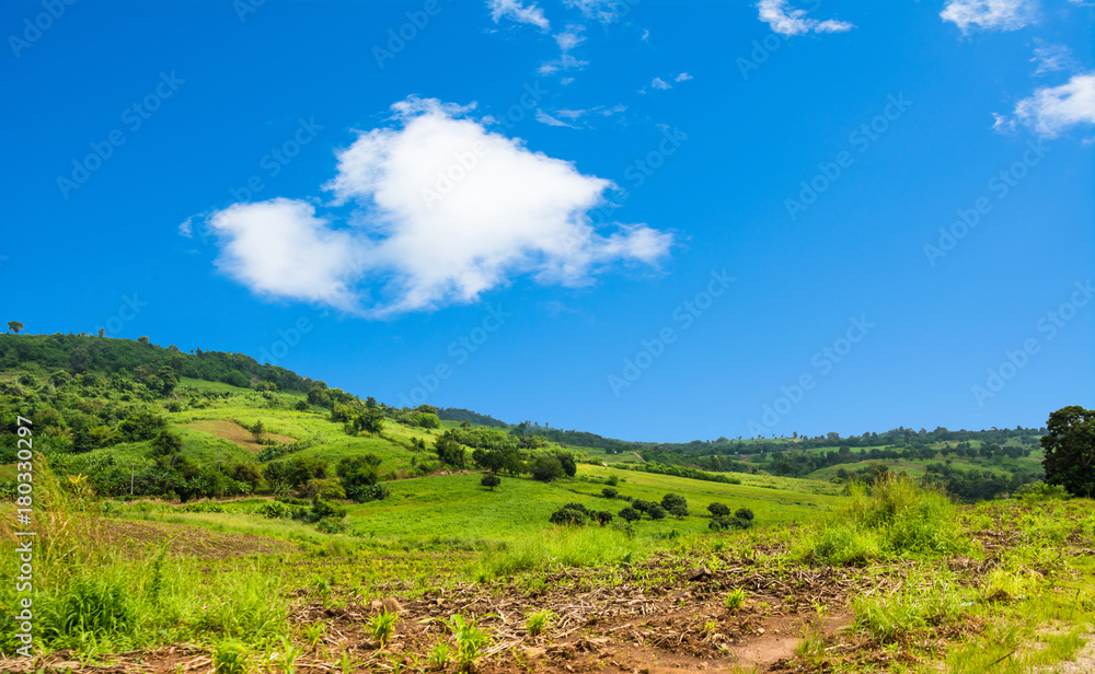 Mountain with blue sky bright with white cloud background