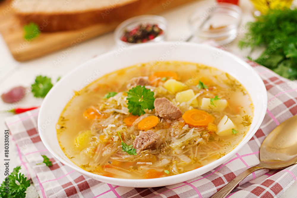 Traditional Russian soup with cabbage - sauerkraut soup.