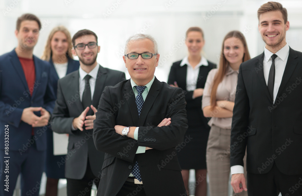 portrait of senior businessman and employees of the company. portrait of senior businessman and employees of the company.