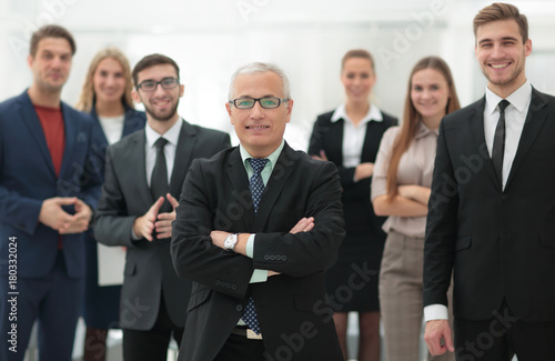 portrait of senior businessman and employees of the company.