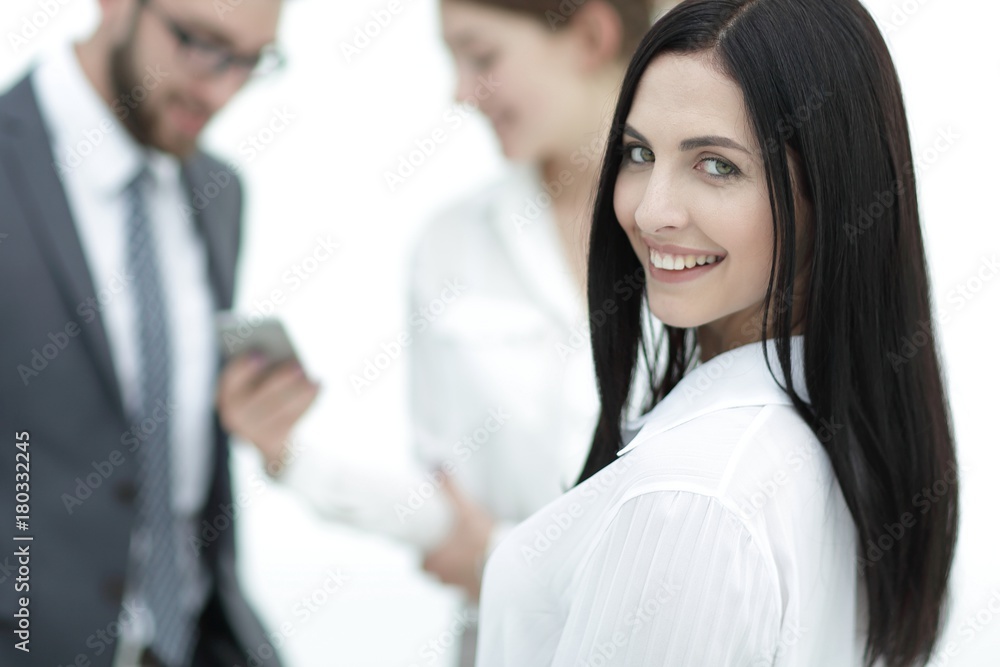close-up of a beautiful woman manager and co-workers in the office close-up of a beautiful woman manager and co-workers in the office