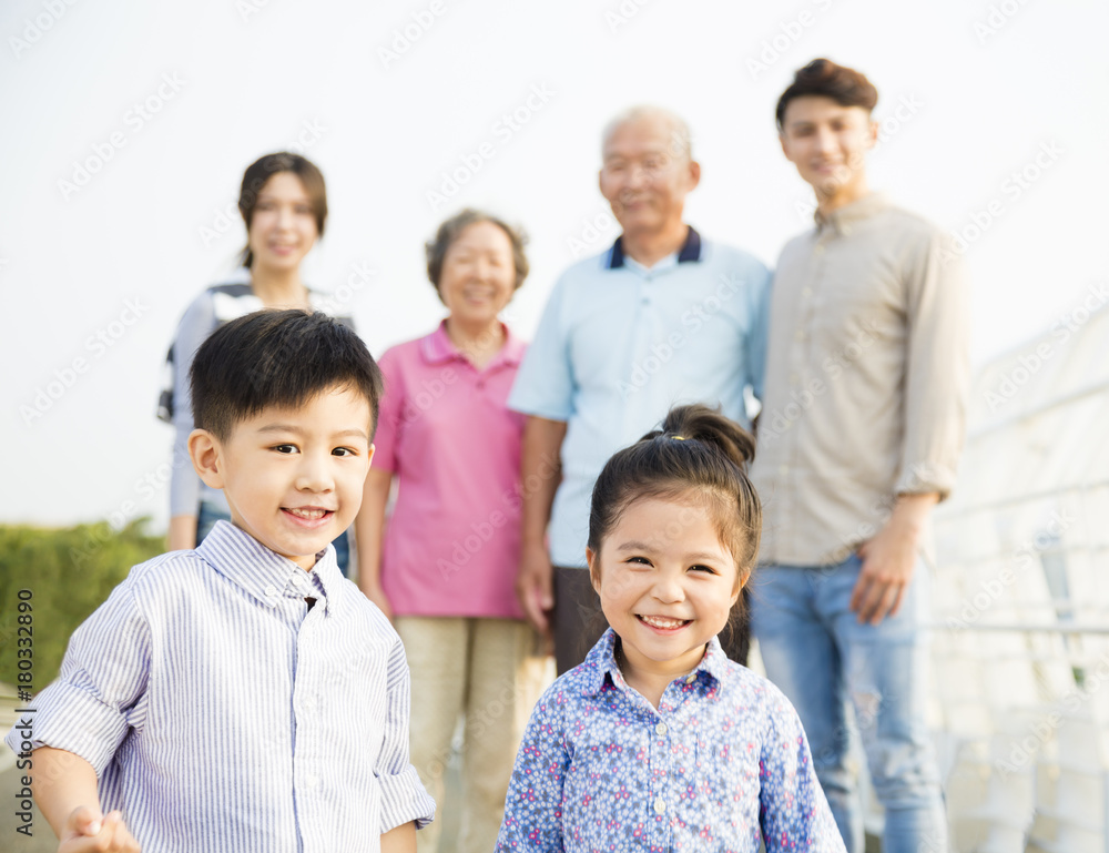Multi-generation family having fun together outdoors. Multi-generation family having fun together outdoors.