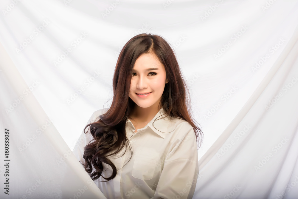 Portrait of a pretty smiling woman posing isolated on a white background Portrait of a pretty smiling woman posing isolated on a white background