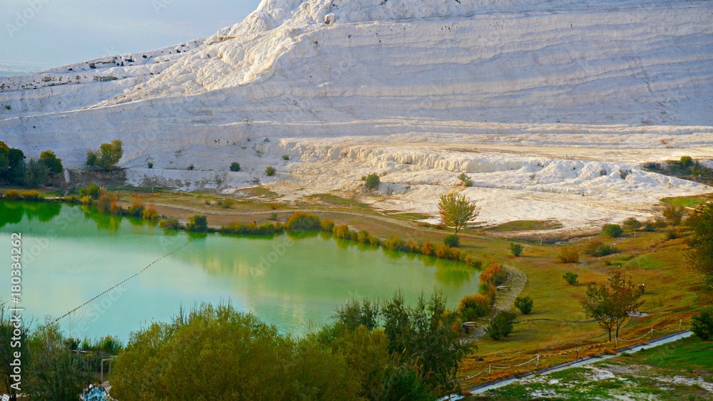 travertines with blue water in pamukkale, turkey.