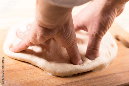 Baker makes dough for bread © Galina Semenko