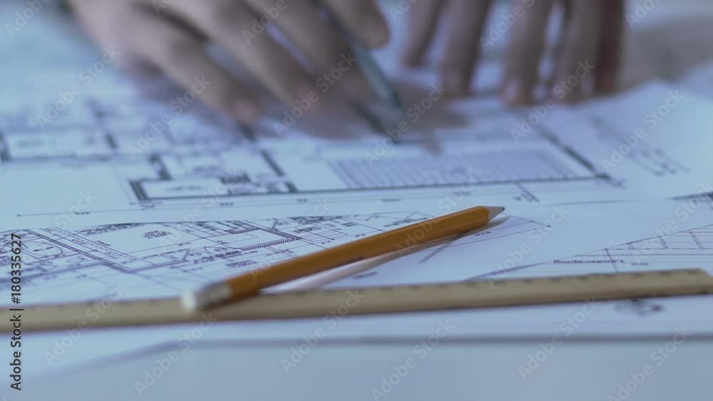 Student working on building project for contest, innovations in architecture Student working on building project for contest, innovations in architecture