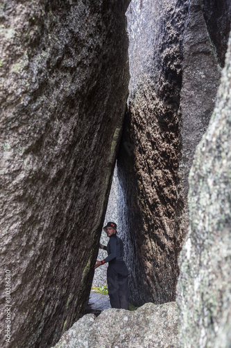 Man Standing Between Rock Walls and Looking Forward-visionary Concept.