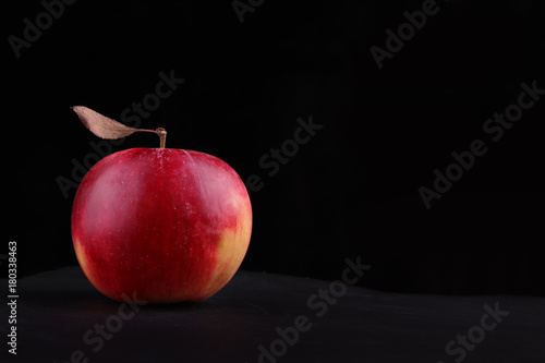ripe red apple with yellow sides