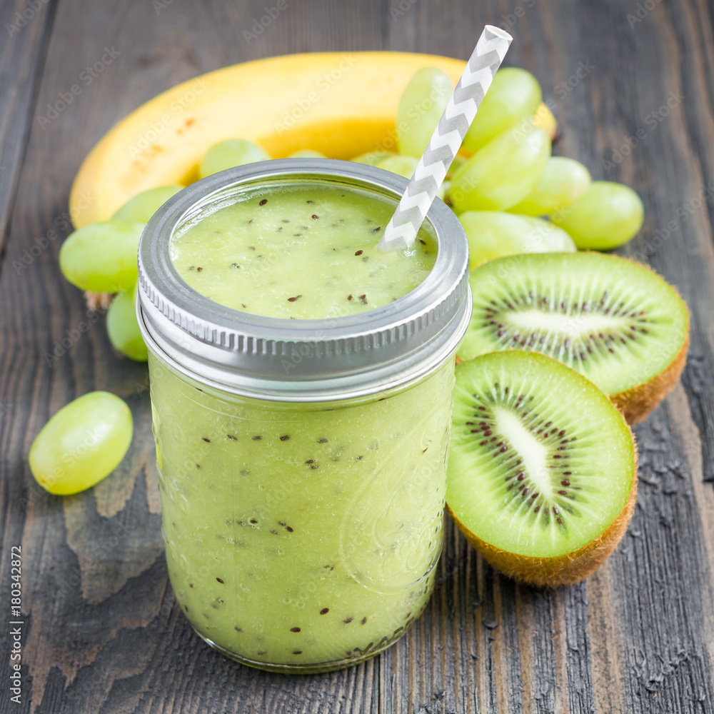 Healthy smoothie with kiwi, green grape, and banana in glass jar, square Healthy smoothie with kiwi, green grape, and banana in glass jar, square