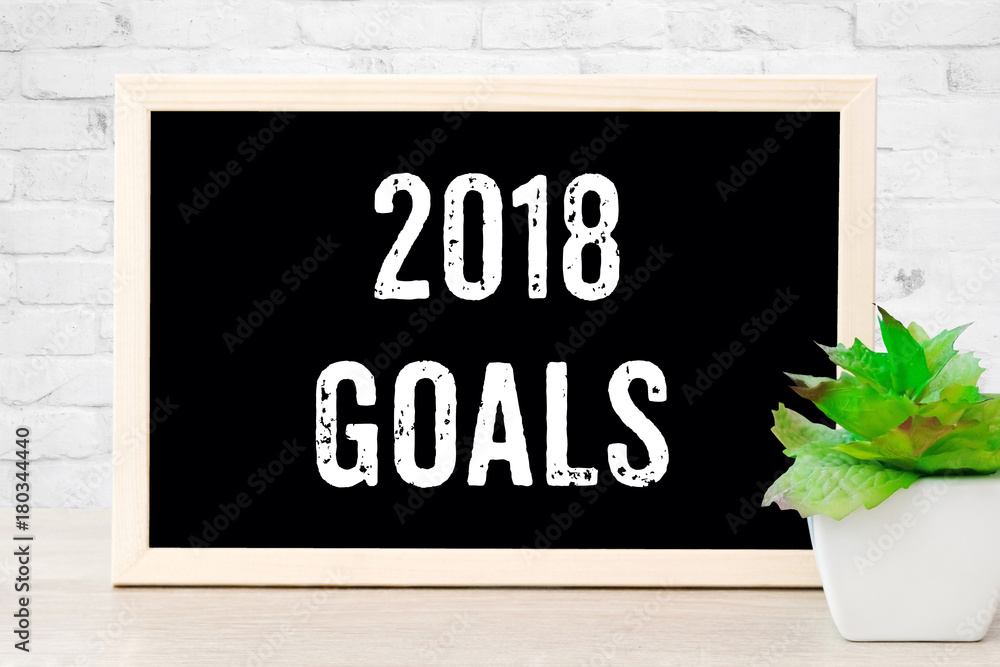 2018 goals on chalkboard background, new year aim to success in business on blackboard sign