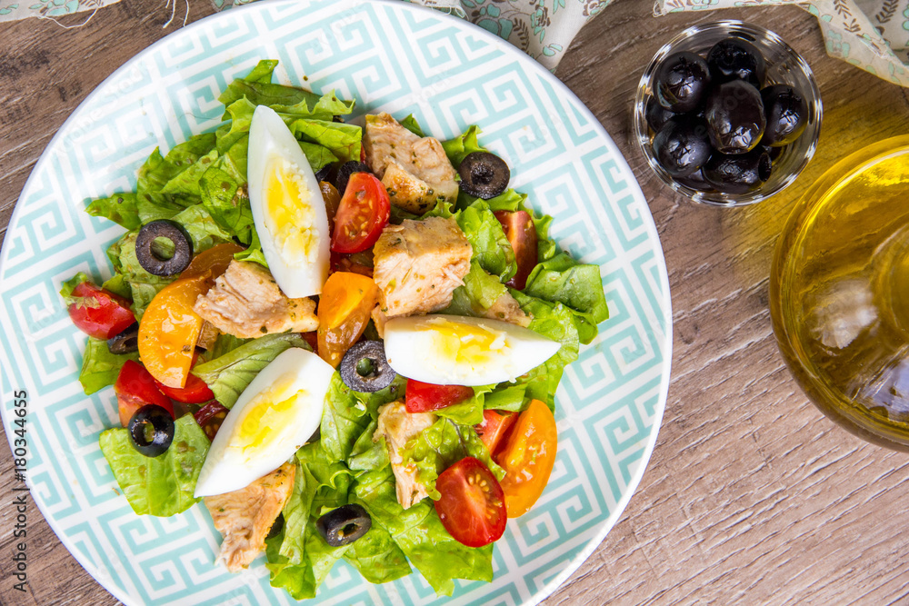 Green salad with chicken, lettuce, egg, olives, tomatoes, healthy lunch, tatsy Green salad with chicken, lettuce, egg, olives, tomatoes, healthy lunch, tatsy