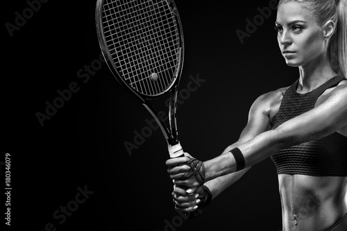 Beautiful blonde sport woman tennis player with racket in red costume