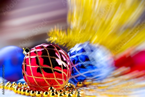 Red christmas ball with motion blurred christmas background