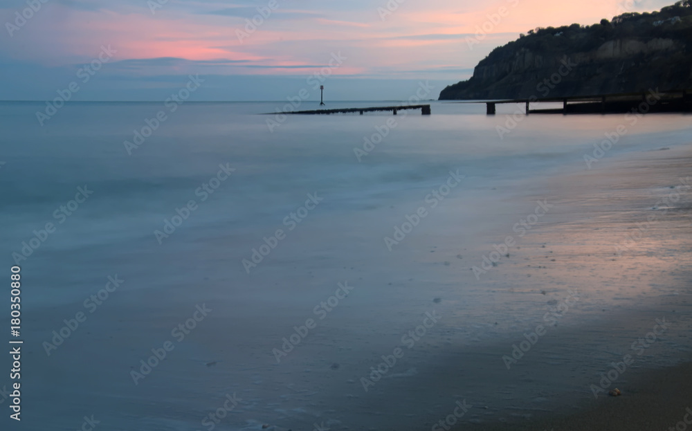 Dusk on the Isle of Wight. As the light goes low a feeling of tranquility can be felt in this long exposure shot of an English Island. Featuring a beautiful sky and dusky colors reflected in the Sea.