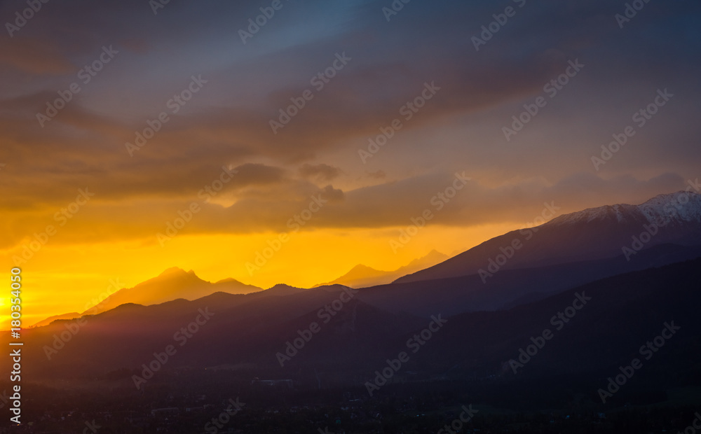 Sunset over peak Havran in Tatra mountains from Koscielisko, Poland