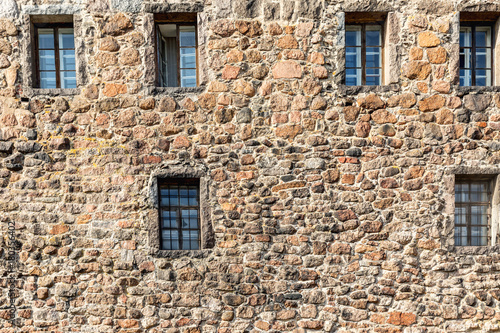 Gated window on the wall of an old building