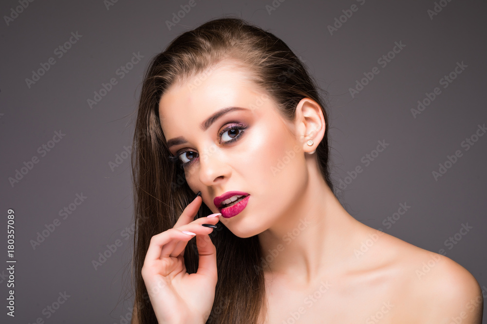 Beautiful Woman Skin Tanned Red Lips Healthy Beauty Skin Smile. Spa Beautiful Model Girl Cute Face over gray background. Beautiful Woman Skin Tanned Red Lips Healthy Beauty Skin Smile. Spa Beautiful Model Girl Cute Face over gray background.