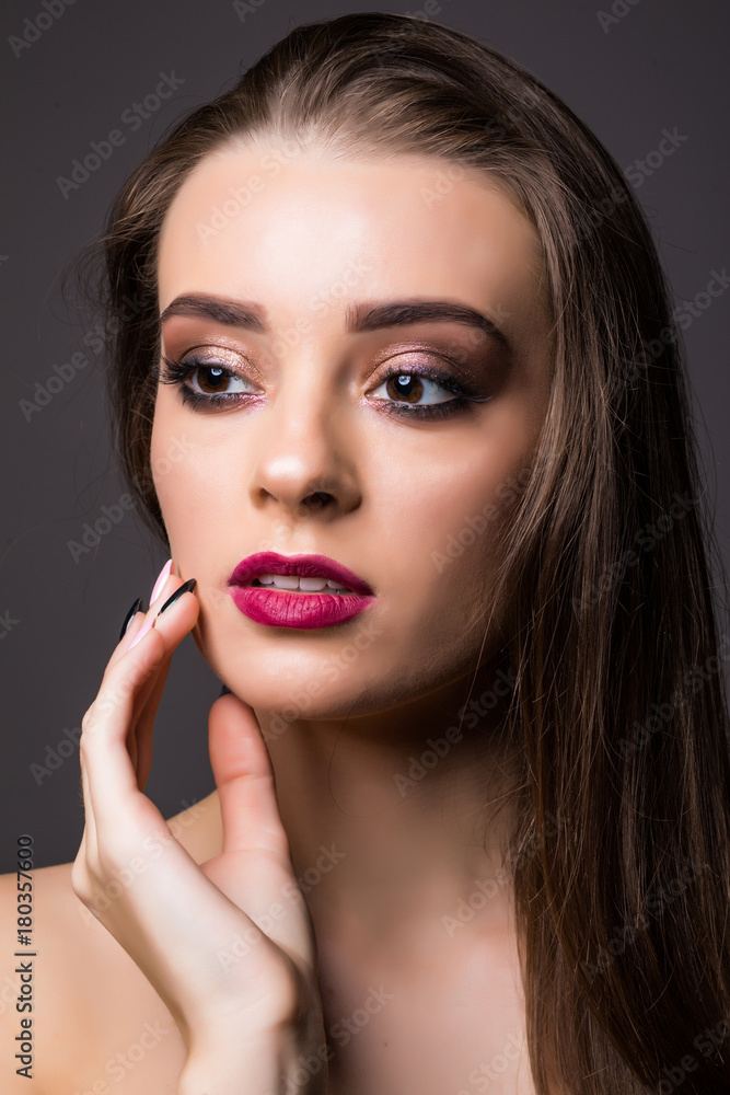 Beautiful woman with professional make up on dark background Beautiful woman with professional make up on dark background