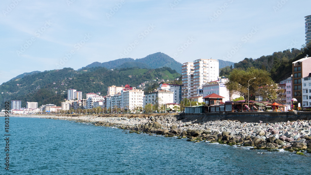 
Turkey.Hope in the Artvin silt. Provincial city on the Black Sea coast. High snow capped mountains on a background of a summer landscape with colorful houses of the city of Hopa