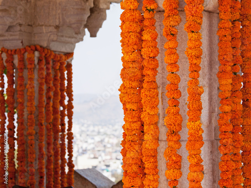 Hanging marigold flower decorations at a Hindu wedding celebration in Rajasthan, India 