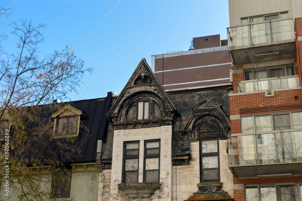 Obraz premium Expensive old and new houses with huge windows in Montreal downtown, Canada.
