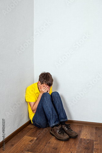 Sad Teen in the Corner