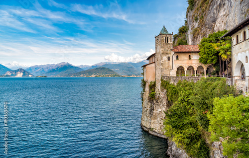Hermitage of Santa Caterina del Sasso is rock face directly overhanging the lake Maggiore, Leggiuno, Italy photo