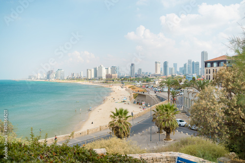 Viev on the beach and urban city Tel-Aviv. Summer coastline. Famous tourist place