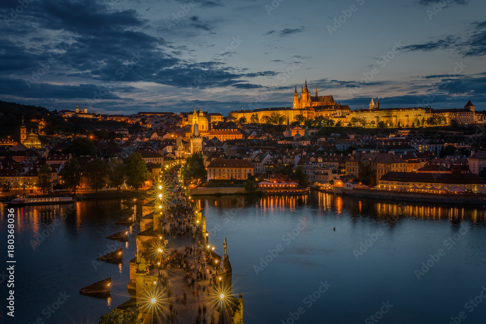 Fotografie Sunset over Charles Bridge and Prague Castle