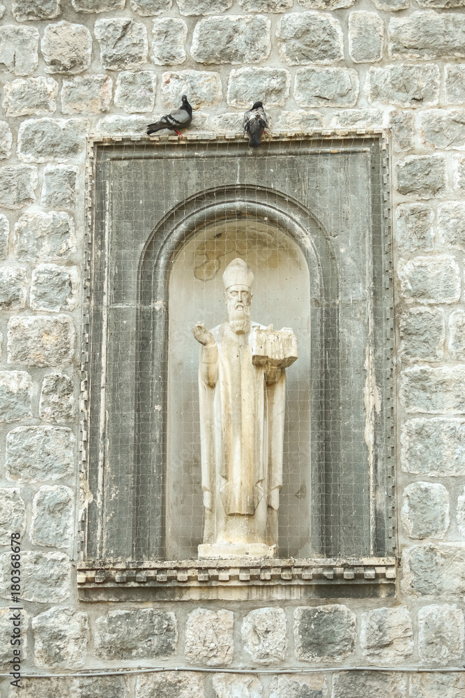 The statue of Saint Vlaho on the walls of old town in Dubrovnik, Croatia. The statue of Saint Vlaho on the walls of old town in Dubrovnik, Croatia.